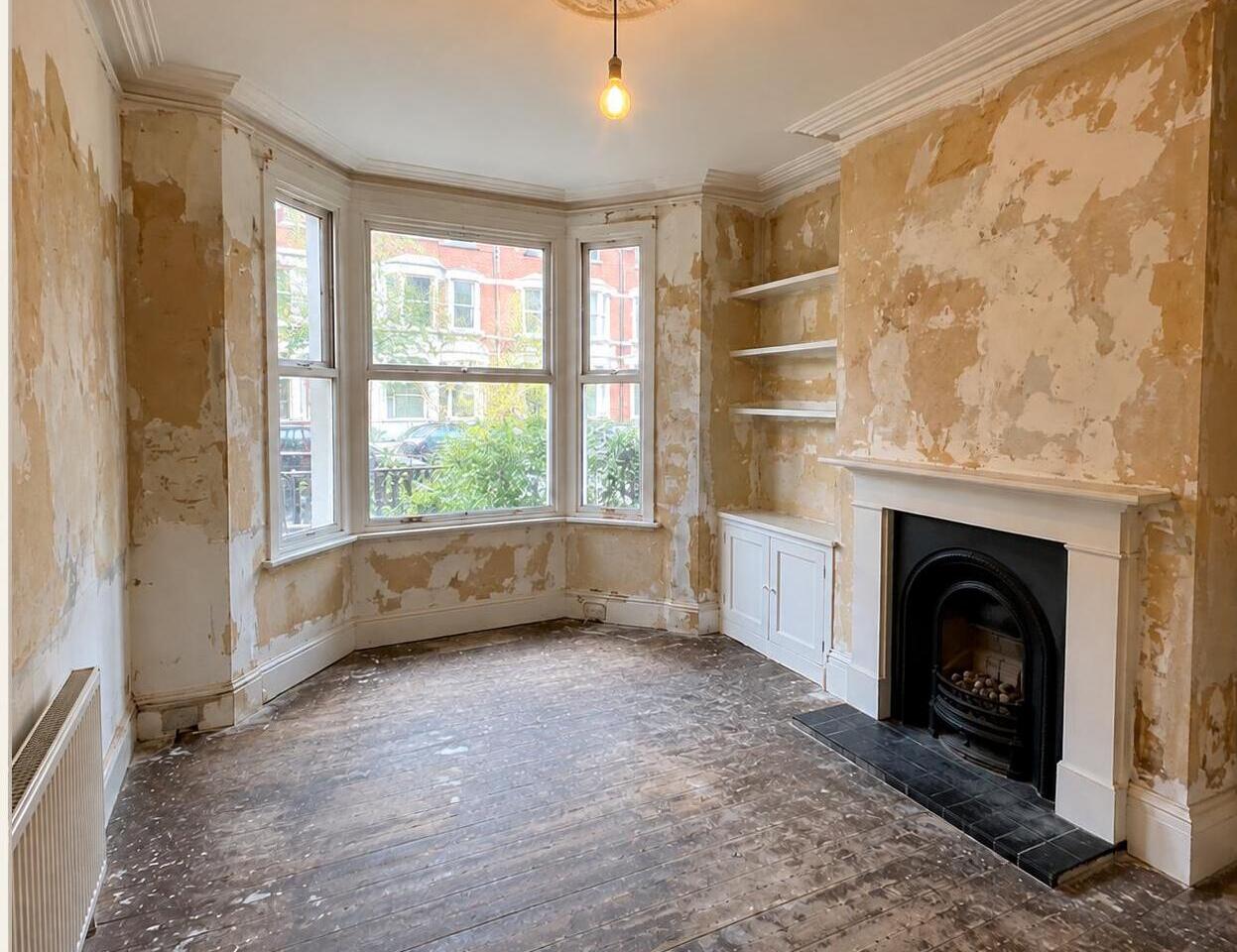 Period living room before decorating — stripped back to bare plaster